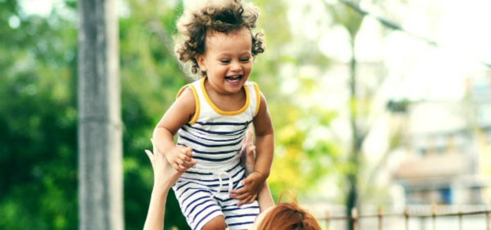 A child playing with their parent