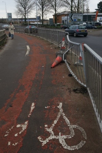 Photo of damaged cycle lane and barrier that car has crashed in to