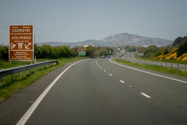 Photo of road and Holyhead welcome sign