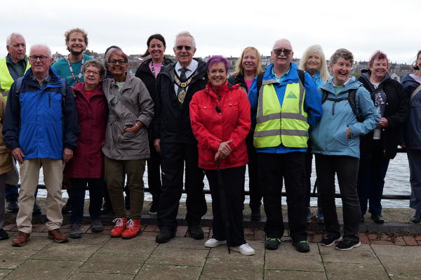 Photo of Dawn Boden Minister for Children and Social Care and a group of older people.