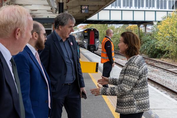 First Minister Eluned Morgan and Liverpool City Region Mayor Steve Rotheram at Llandudno Junction station along with the chair of Transport for Wales Vernon Everitt.