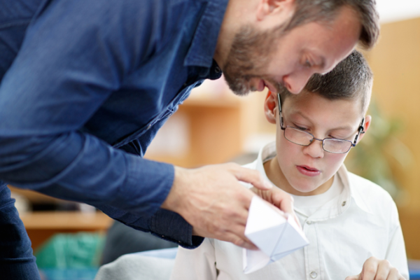 Teacher and learner explore arts and crafts activities.