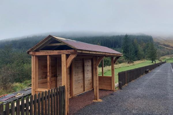 A weather proofed shelter alongside Brecon Mountain Railway