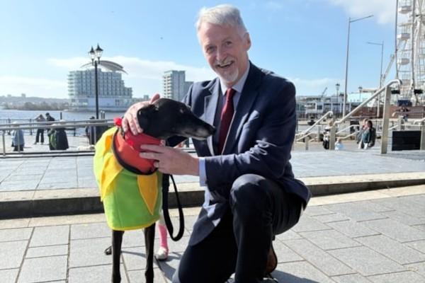 Huw Irranca-Davies with a greyhound