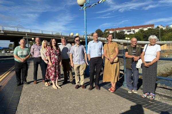 Cabinet Minister for Rural Resilience and Sustainability, Llyr Gruffydd, with flood-hit Milford Haven residents