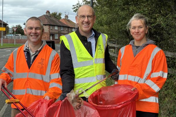 Cabinet Minister for Rural Resilience and Sustainability, Llyr Gruffydd attending a litter pick. 